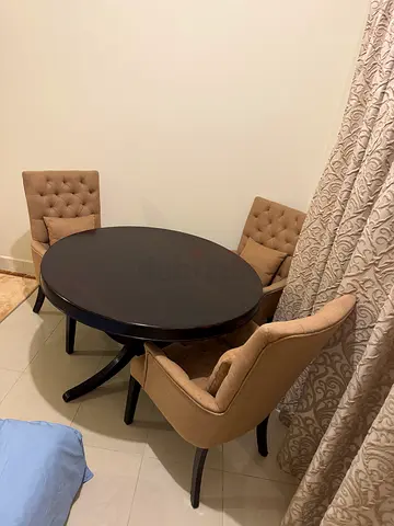 Marina Home | Round solid dark-wood dining table with 4 beige tufted chairs - good condition