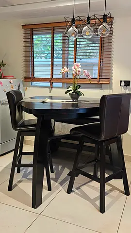 Black round dining table with 2 matching chairs and 1 matching bench in good condition