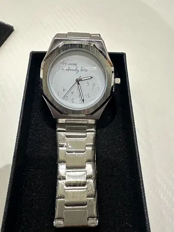 Silver analog wristwatch with metal band - used