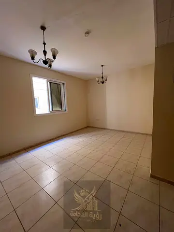 Two bedrooms and a living room for rent in Al Majarra area.