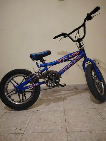 Blue kids BMX-style bicycle - small frame, single speed