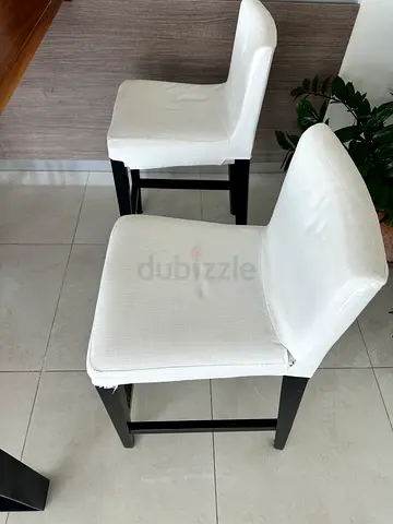 Set of 4 white upholstered dining chairs with dark wooden legs