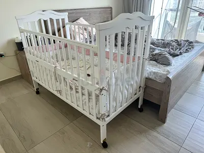 White Wooden Baby Crib with Wheels - Good Condition