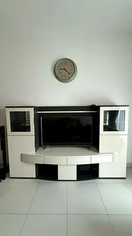 TV Unit - White high-gloss entertainment center with display cabinets