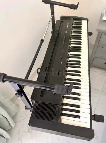 Used Roland Portable Electronic Keyboard with Stand - Good Condition