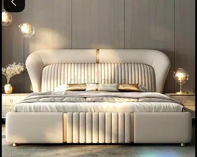 Modern upholstered king-size bed with padded headboard
