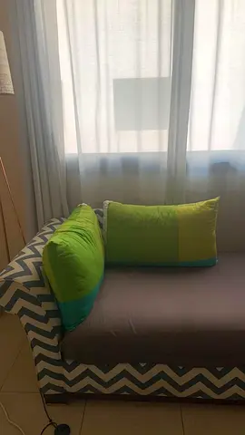 Two-seater patterned sofa with cushions - good condition