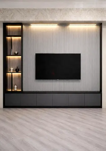 Modern built-in entertainment center with backlit display shelves and TV wall