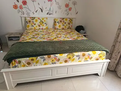 White Wooden Double Bed Frame with side tables, dresser and wardrobe.