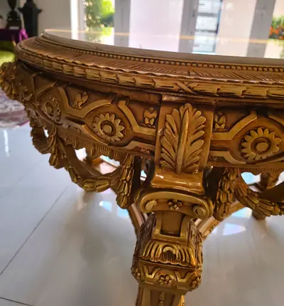 Ornate Gold-Colored Carved Round Accent Table with Glass Top