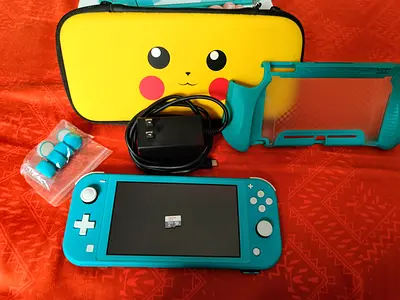 nintendo switch lite almost new with maicro sd card 128G🪩(the price include the accessories