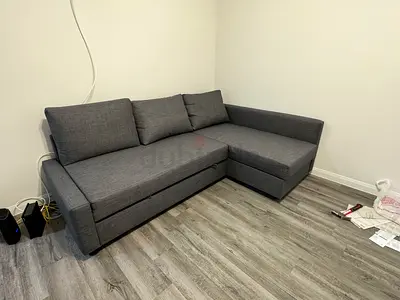 Gray L-shaped corner sofa bed - good condition