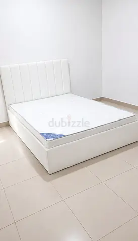 Brand new White faux leather double bed with mattress -