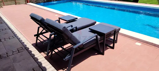 Pair of Outdoor Chaise Lounges with Side Tables - Good Condition