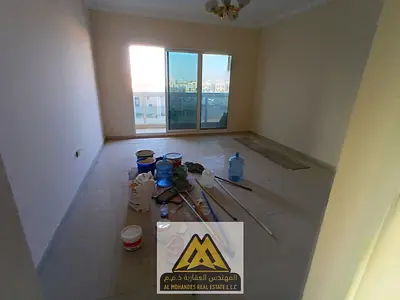 Two-bedroom apartment with a living room in Al Muweihat 3, including a master bedroom, 2 bathrooms,