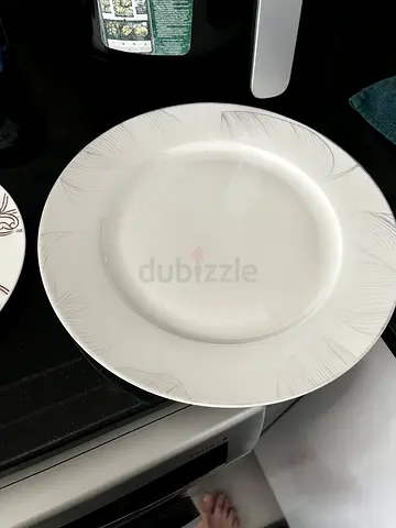White Ceramic Dinner Plate with Decorative Pattern
