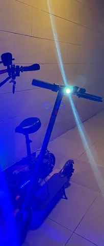 Barely Used electric scooter with front light - good condition and new battery and airless tires