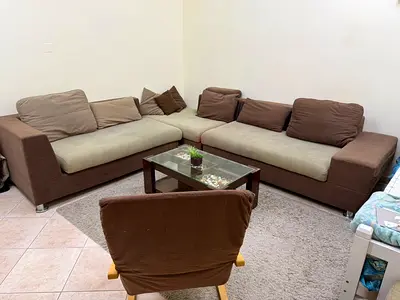 L-shaped brown fabric corner sofa with coffee table - good condition