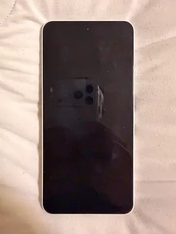 Used smartphone with full-screen display - good working condition