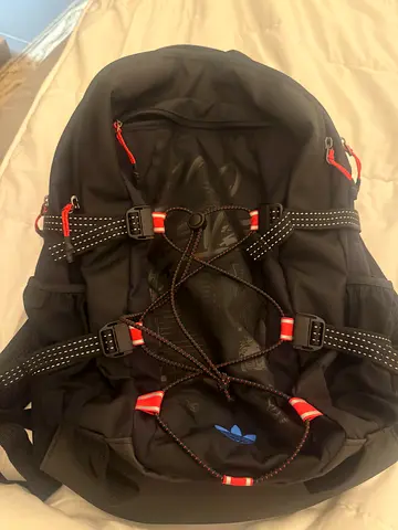 Black Adidas backpack with multiple compartments — new never used.