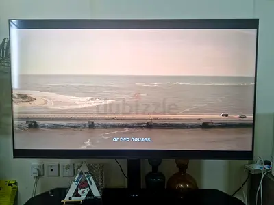55-inch LED Smart TV on stand - Good condition some scratches on screen with TV unit