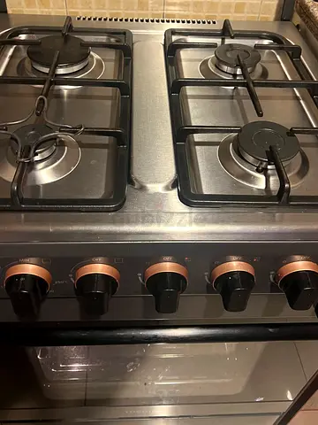 Stainless Steel 4-Burner Gas Stove with Built-in Oven — Good Condition