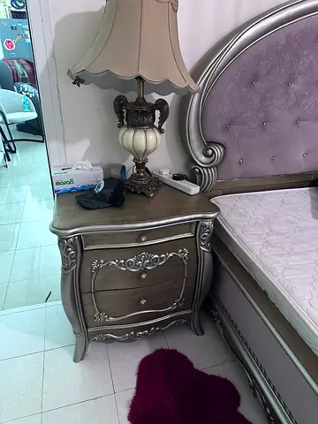 Classical Bedroom Set with Silver Details including bed, side tables, vanity, two chairs.