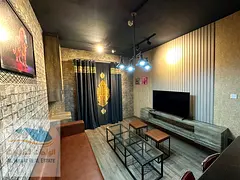 For annual rent: One bedroom, living room, two bathrooms, and balcony, furnished, in City Tower Al N