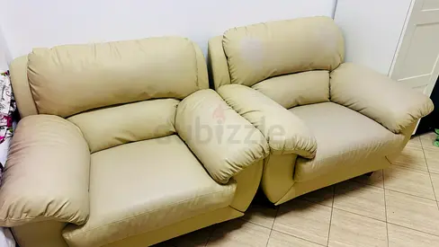 Beige leather 2-seater lounge chairs — comfortable pair