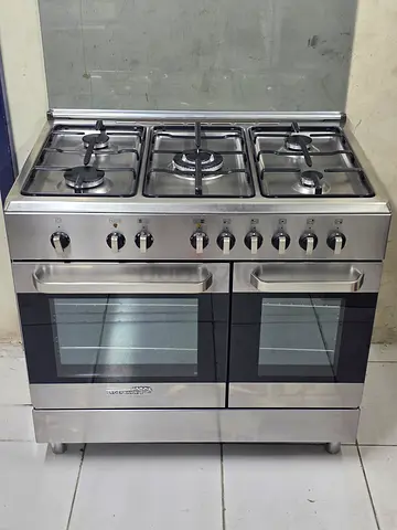 La germania cooker tap gas dual oven electric size 90by60cm 5 burnal latest model perfect working A1