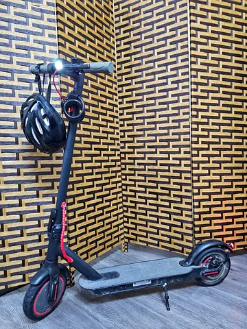 Electric scooter with helmet and lock