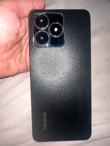 Realme smartphone in good working condition — black, rear triple camera