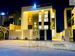 A distinctive villa with a modern facade, private garden, and spacious rooftop terrace in a prime lo