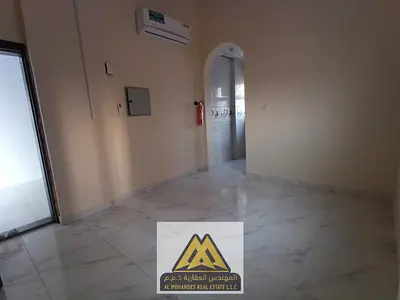 Apartment for annual rent in Ajman, Al Rashidiya 2 area, next to Nesto. Two bedrooms, living room, two bathrooms, central air conditioning. Price: AED