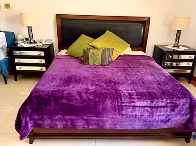 Queen size wooden bed frame with headboard and two bedside tables