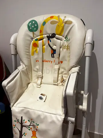 Used baby high chair with padded seat cover - good condition
