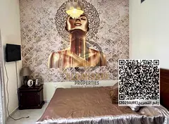Two-bedroom apartment with a living room in Emirates City, fully furnished.