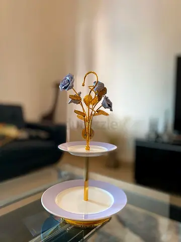 Two-tier decorative serving tray with gold floral handle