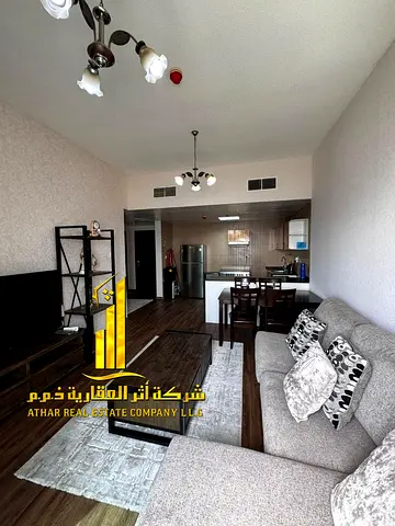 Luxury one-bedroom apartment with a balcony and open views. Ajman City Tower. Fully furnished, available for monthly rent.
