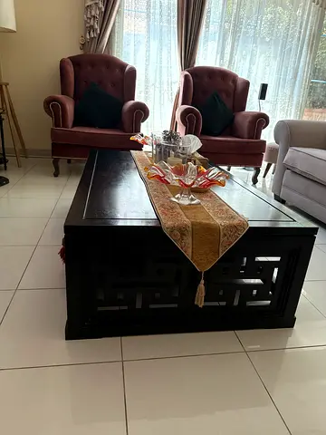 Solid dark wood coffee table with decorative inlay