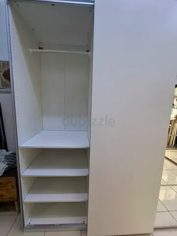 White modular shelving unit / wardrobe organizer with multiple compartments
