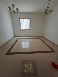 For rent in Abu Shagara Sharjah spacious one bedroom and living room with central AC and two bathroo