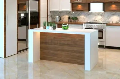 Modern kitchen island with white quartz top and wood paneling