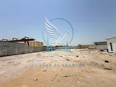 For Rent: Yard in Al Sajaa | Prime Strategic Location | Close to the Main Road | 20,000 Sq. Ft. | Of