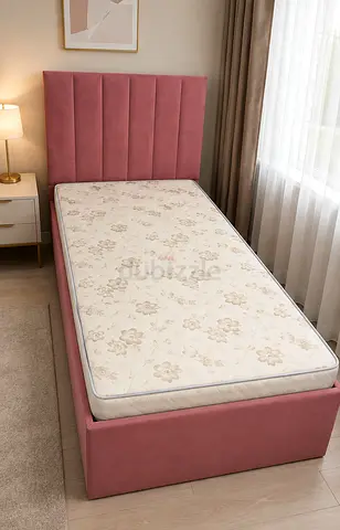 Single pink upholstered bed frame