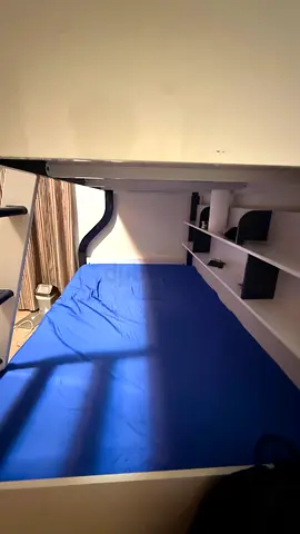 3 beds bunk bed with built-in shelves and ladder. Very good condition. 3 mattresses included .