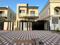 Villa for sale in Ajman, Al Muwaihat area. 5 master bedrooms, majlis, living room, and maid's room. 