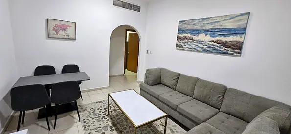 One-bedroom apartment with a living room, located directly off the Dubai exit.