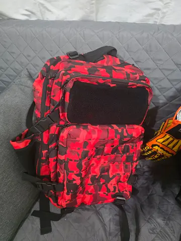 BUILT FOR ATHLETES. Red Camouflage Backpack - 45L Spacious, durable, compartments.