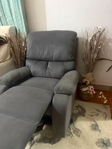Grey recliner armchair in good condition